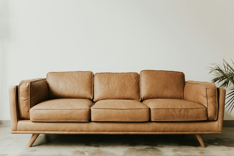 After: Heritage wooden sofa with French PU polish and jacquard fabric